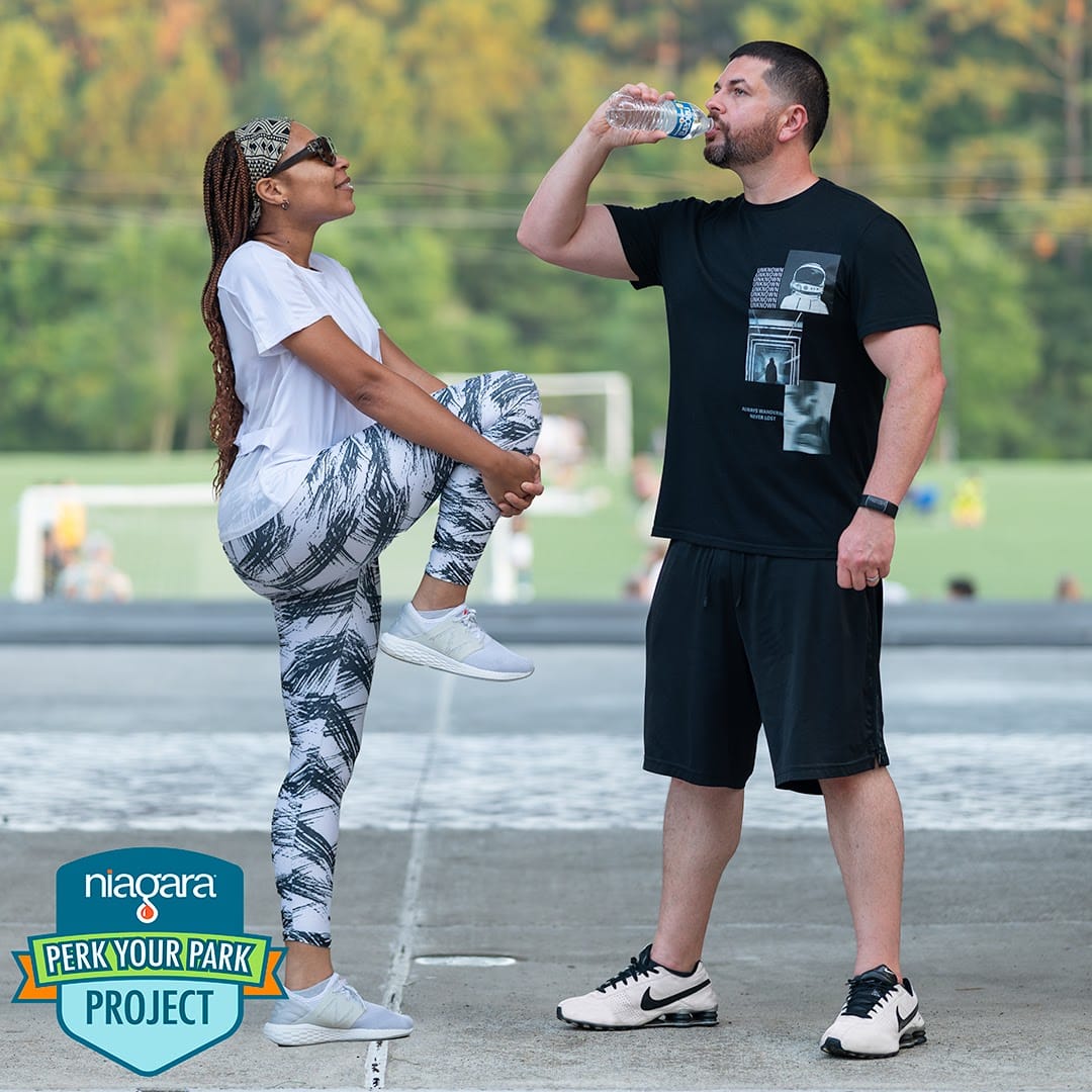 Mom brand ambassador promoting wellness with a branded water bottle during workout, reinforcing everyday product use and loyalty.