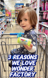 Toddler in Walmart shopping cart holding a sponsored toy, featured in mom influencer content promoting family-friendly brands.