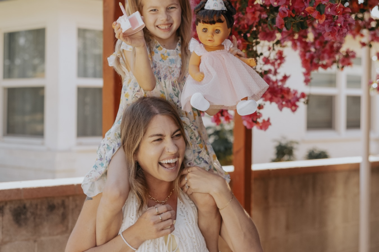 Mom influencer sharing a joyful, real-life moment with her child, reflecting how Gen Z moms value authenticity, lived experience, and trust when evaluating brands.