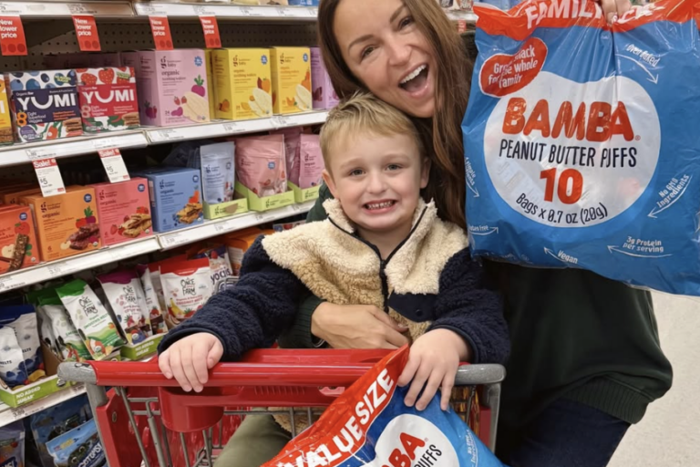 Mom influencer shopping with her child and evaluating a family product in-store, showing how Gen Z moms rely on real-life context and lived experience when making purchase decisions.