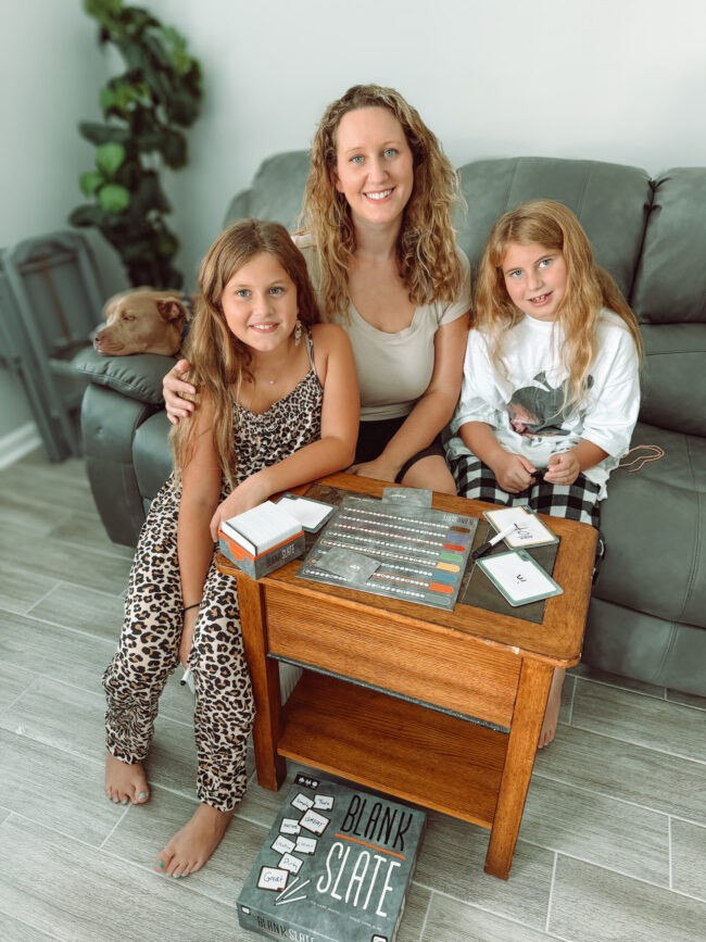 Mom influencer and her children testing a gifted family board game at home, showcasing authentic influencer gifting campaigns for moms and Gen Z parents led by BSM Media.